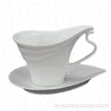 New bone cup and saucer with spoon